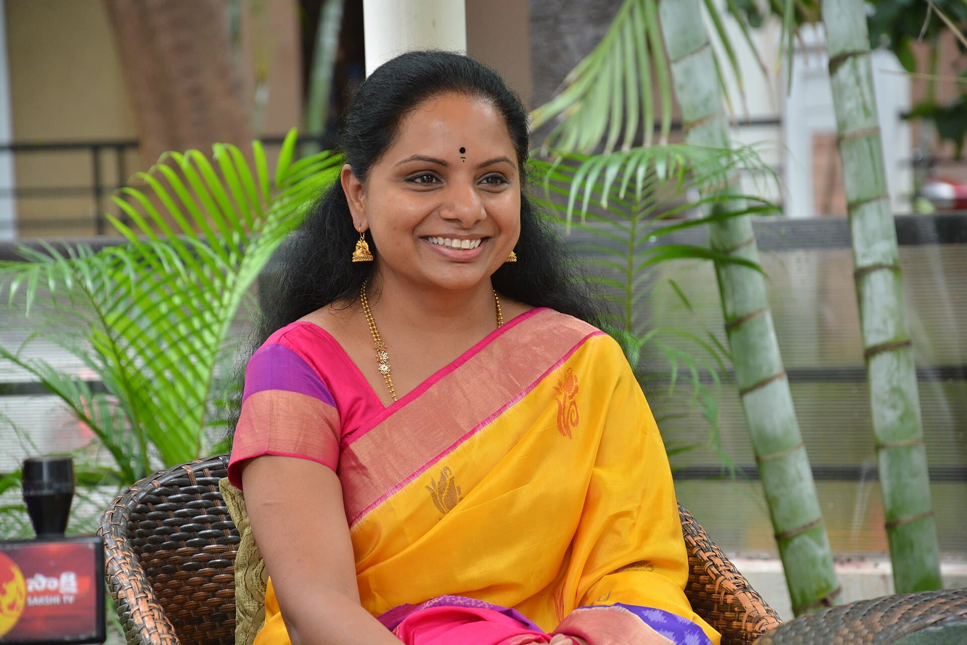 K. Kavitha in a yellow sari